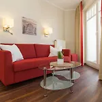 Апартаменты Am - Strandvilla Belvedere Кюлунгсборн