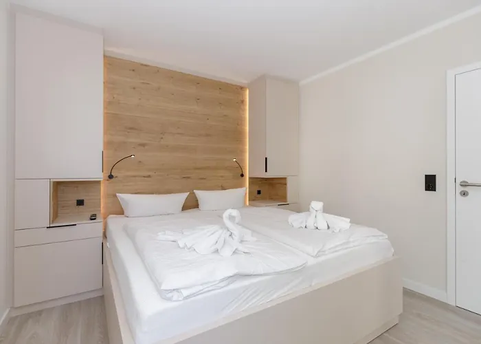 Апартаменты Am - Strandvilla Belvedere Кюлунгсборн